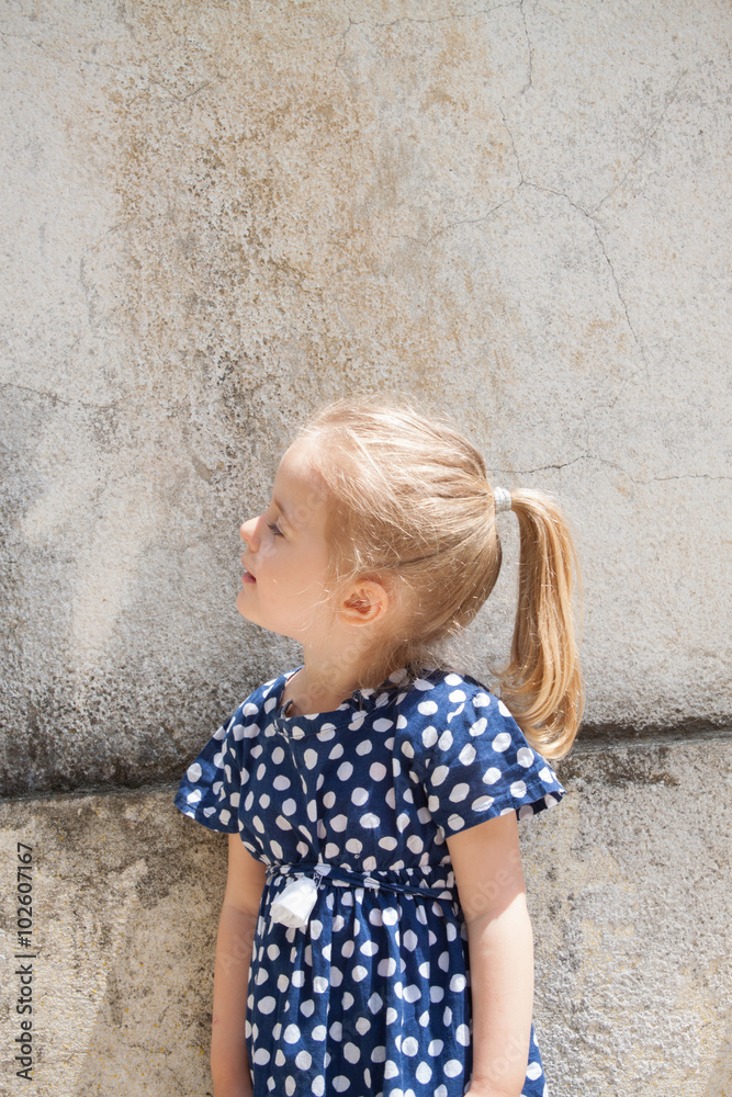 Portrait of a lovely little girl daughter in long blond hair and Portrait of a lovely little girl daughter in long blond hair and