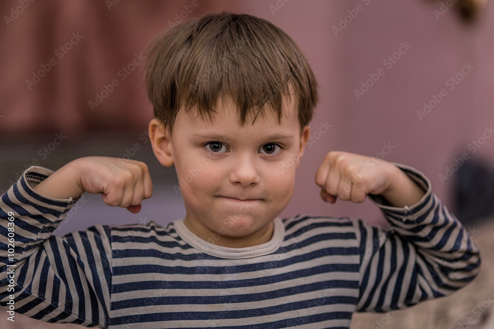 Portrait of a strong little boy. Portrait of a strong little boy.