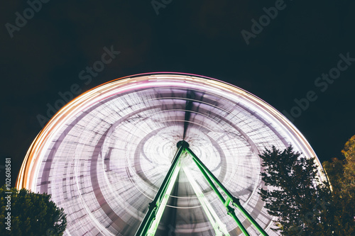 spinning Ferris wheel at night