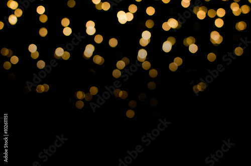 abstract golden yellow colorful circle blur bokeh lights for Christmas festival background. defocused picture