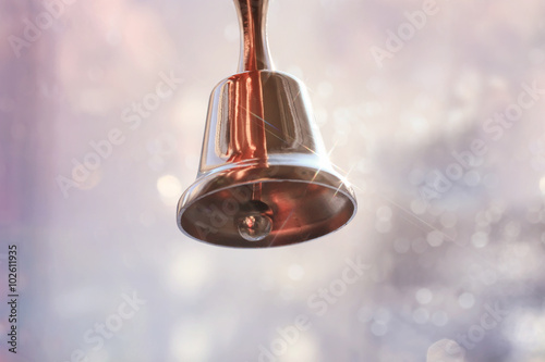 Valokuva shiny metal bell ringing