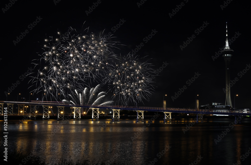 International firework shows light up the sky with dazzling display near Bridge Ponte de Sai Van and Macau tower