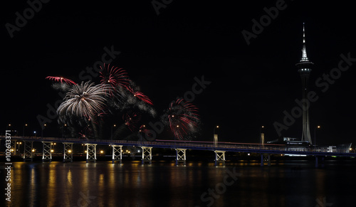 International firework shows light up the sky with dazzling display near Bridge Ponte de Sai Van and Macau tower
