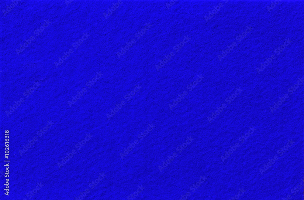 Fototapeta premium Bright blue Felt Background for design. View from above. Close up.