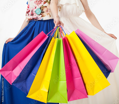 Young women with multicolored shopping bags