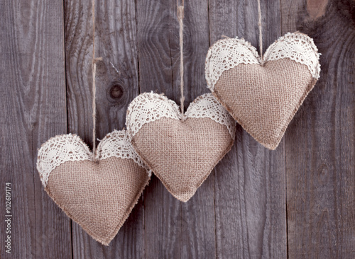 Three sackcloth handmade hearts with lace