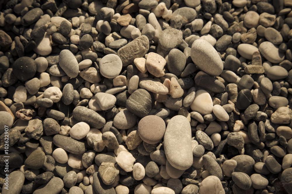 Background of natural pebble on a sea coast. Selective focus. To Background of natural pebble on a sea coast. Selective focus. To