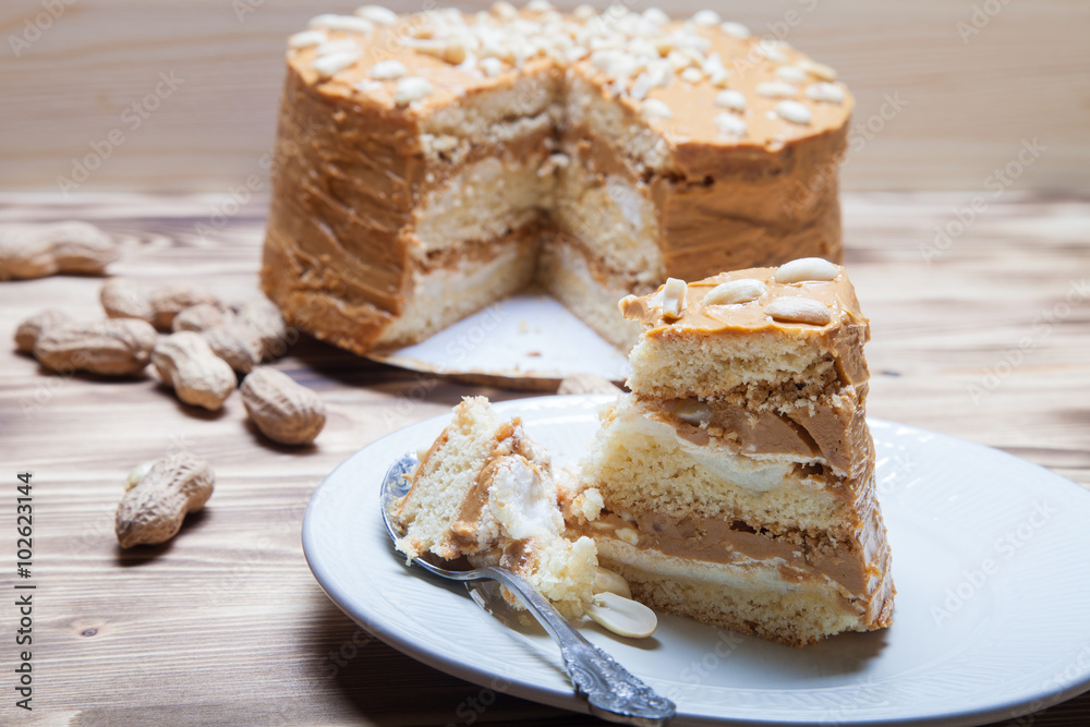 Homemade peanut cake on wooden background. Selective focus Homemade peanut cake on wooden background. Selective focus