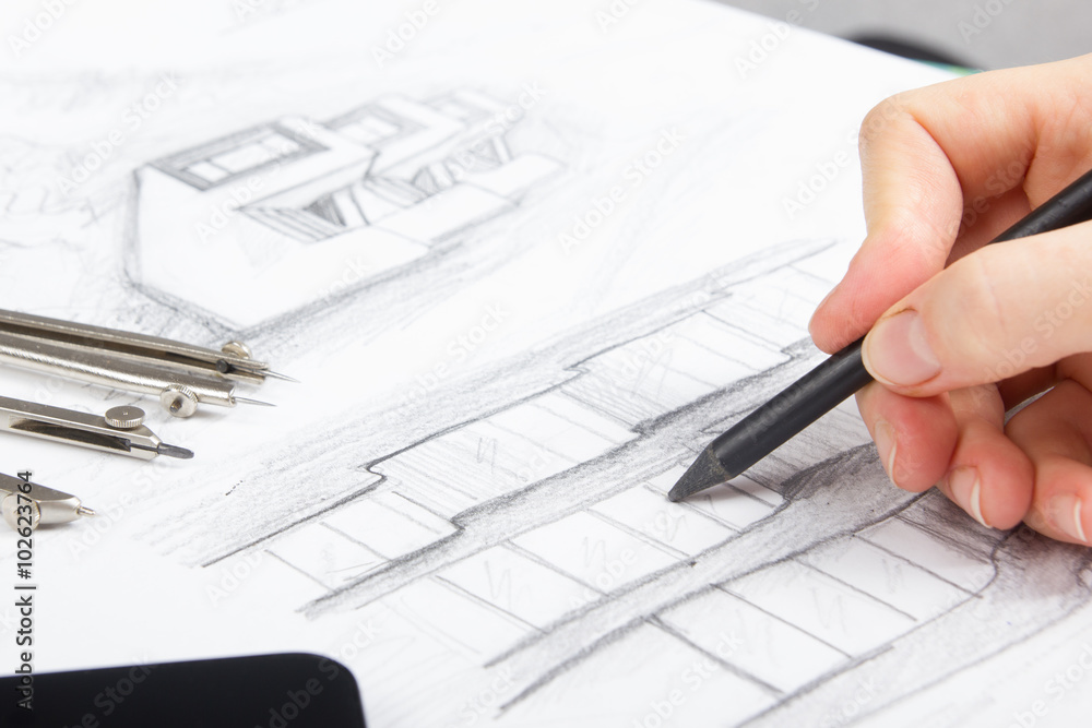 Architect working on blueprint. Architects workplace - architectural project, blueprints, ruler, calculator, laptop and divider compass. Construction concept. Engineering tools Architect working on blueprint. Architects workplace - architectural project, blueprints, ruler, calculator, laptop and divider compass. Construction concept. Engineering tools