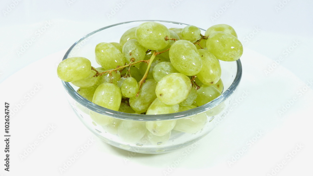 Grapes, fruit in a bowl isolated on white background Grapes, fruit in a bowl isolated on white background