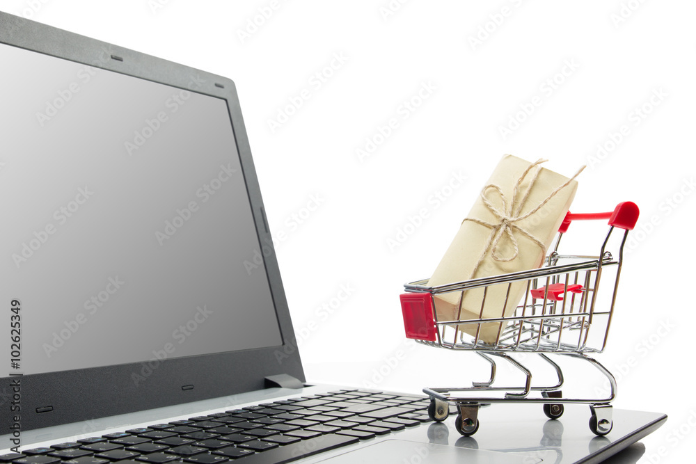 Online shopping concept - Empty Shopping Cart, laptop and tablet pc, smartphone isolated on white background. Copy space for text.