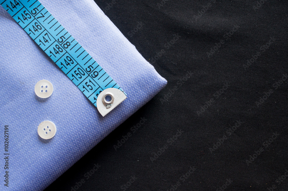 Tailoring essentials fabric, buttons and measuring tape