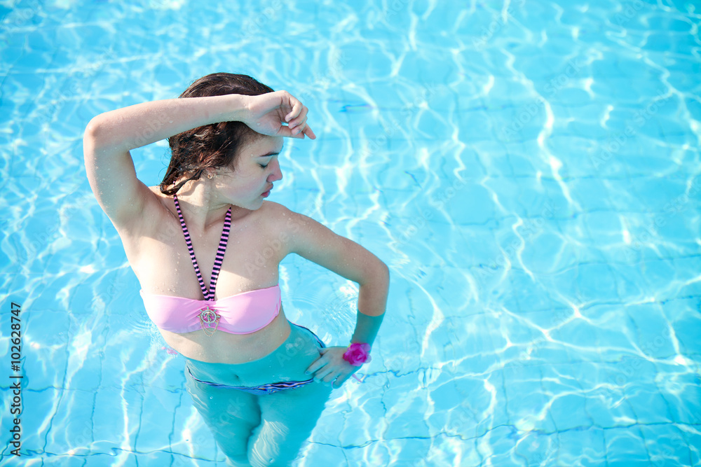 Beautiful girl posing at the pool