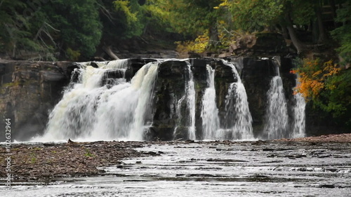 Manabezho Falls, a beautiful waterfall on the Presque Isle River, tumbles over a rocky cliff not in Michigan's western Upper Peninsula. photo