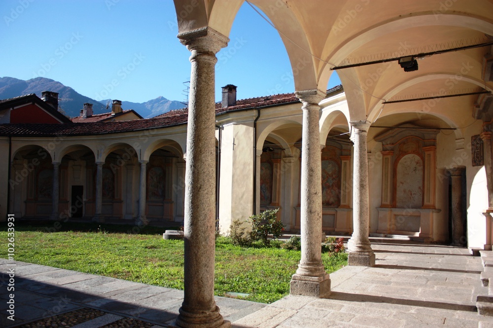 Inner courtyard and arcade of the Church Virgin Mary Assumption in Mergozzo, Italy