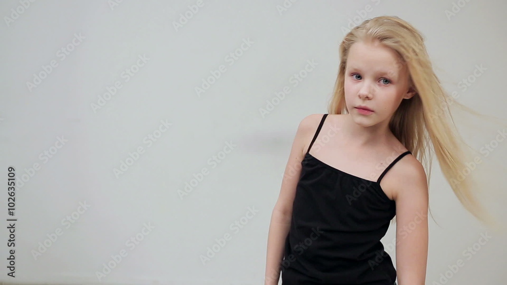 Young girl shows the various model poses Young girl shows the various model poses