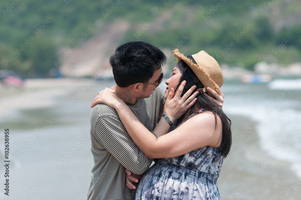 the pregnant Asia girl kiss her husband