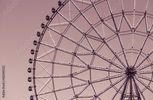 Silhouette of ferris wheel during night time .