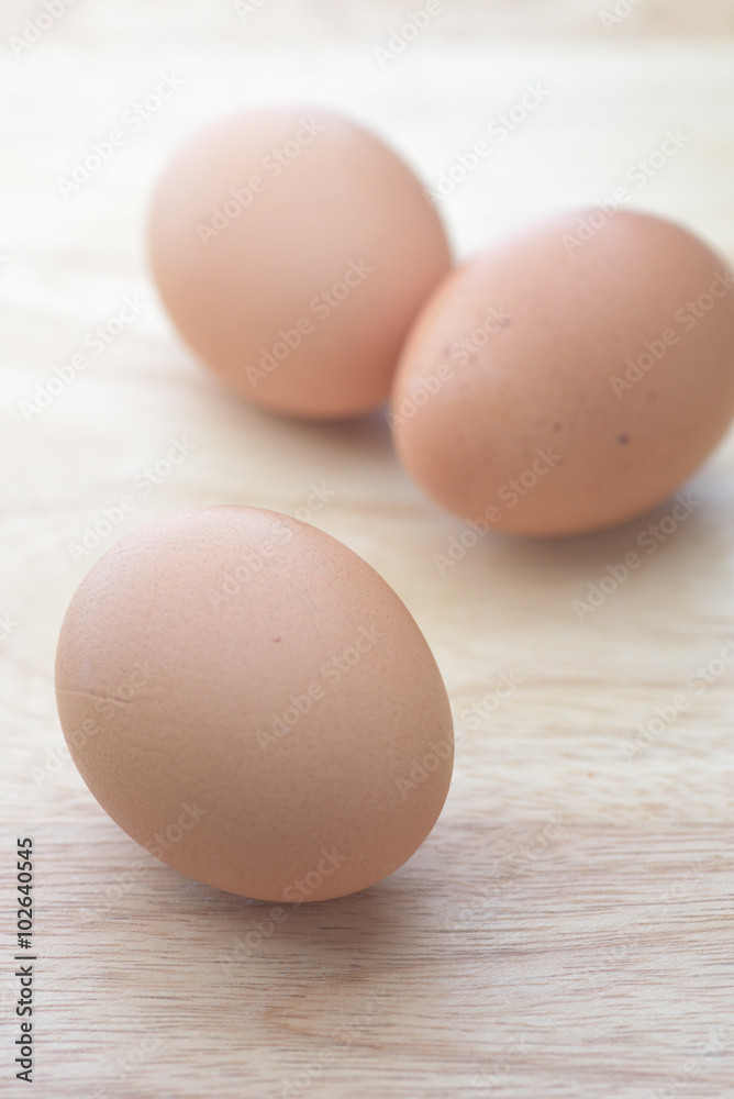 egg on brown wooden background egg on brown wooden background