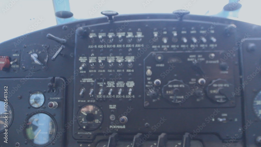 The pilot controls the aircraft using levers, small aircraft