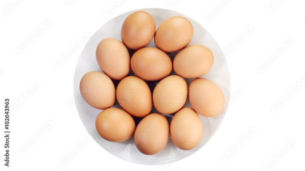 Rotating of egg on white background, top view
Rotating of egg on white background, top view