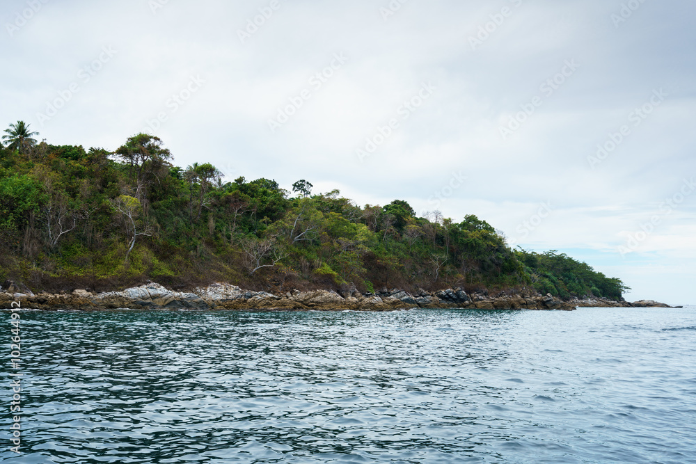 Seascape while boating. View of island coast