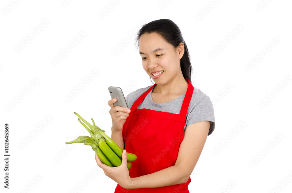 Happy woman take photo of green eggplant before cooking,isolated on white background Happy woman take photo of green eggplant before cooking,isolated on white background