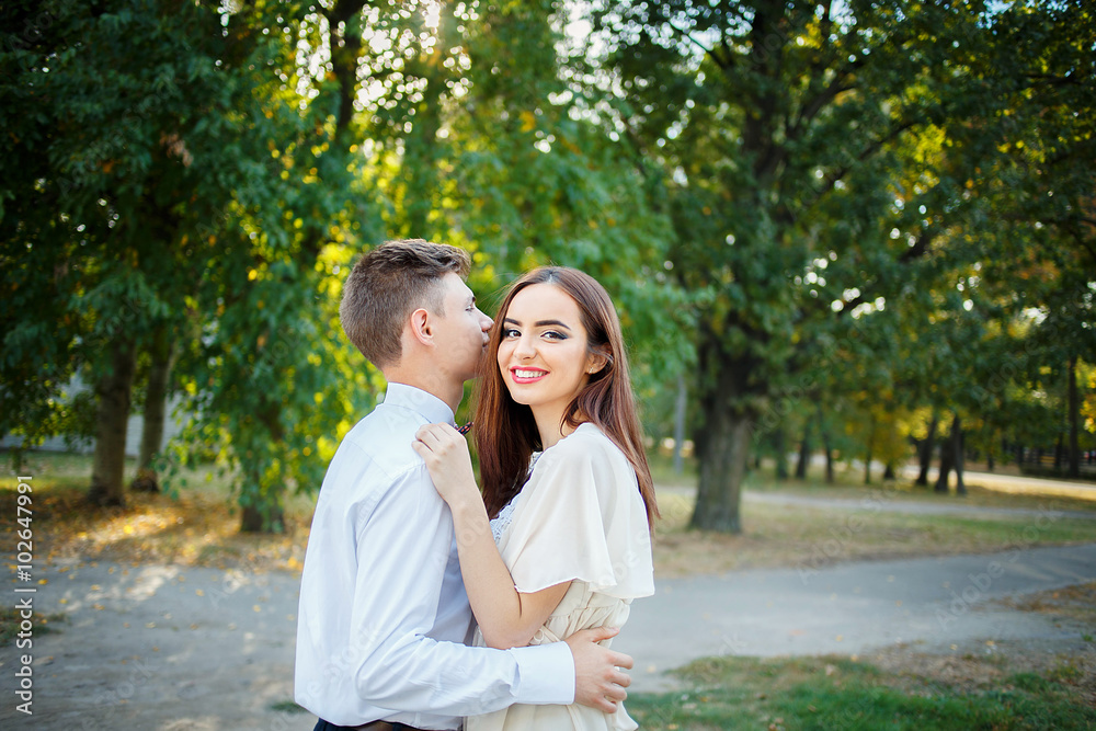 Couple kissing happiness fun. Interracial young couple embracing laughing on date. Couple kissing happiness fun. Interracial young couple embracing laughing on date.