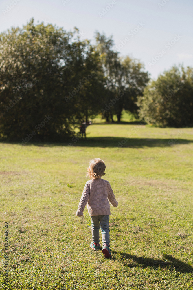 little girl walking and playing in park little girl walking and playing in park