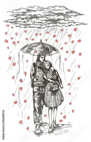 Young couple under umbrella in the rain
