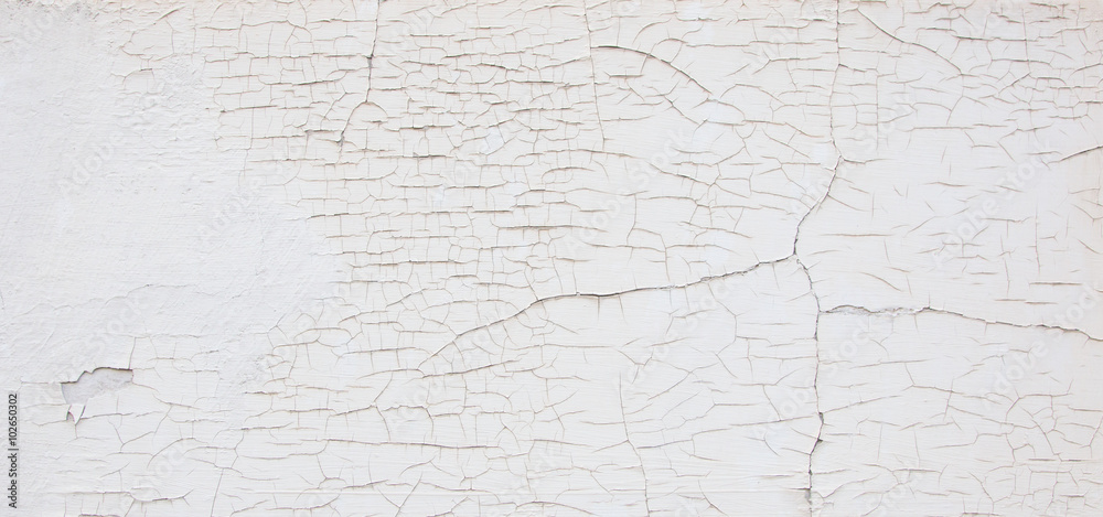 White wall with cracks White wall with cracks