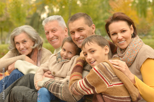 Family relaxing in autumn park © aletia2011