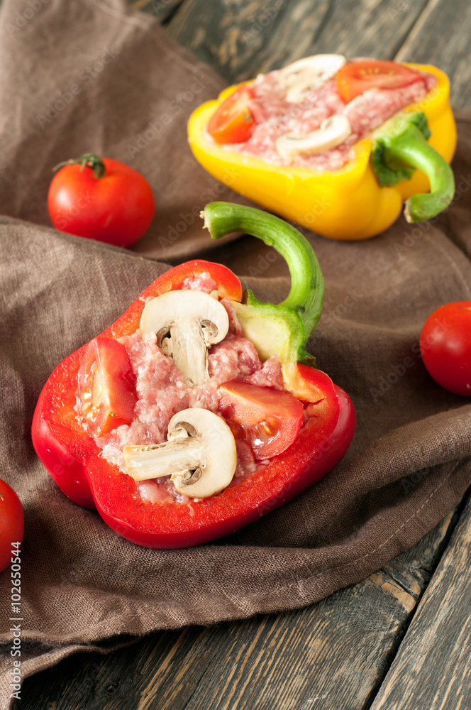 Raw stuffed peppers with minced meat, mushrooms and cherry tomat Raw stuffed peppers with minced meat, mushrooms and cherry tomat