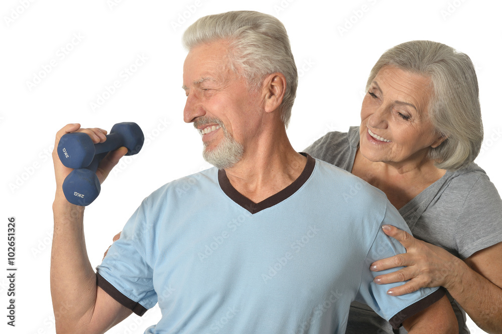 Senior Couple Standing With Dumbbells Senior Couple Standing With Dumbbells