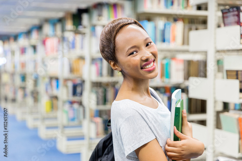 female african college student holding books