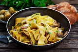 Pappardelle Pasta with mushrooms and other herbs. in wok.