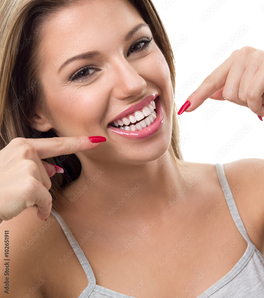 Naklejka premium Woman showing her white teeth