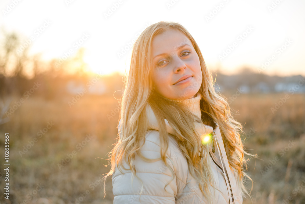 Smiling young woman looking at the camera with blue eyes Smiling young woman looking at the camera with blue eyes