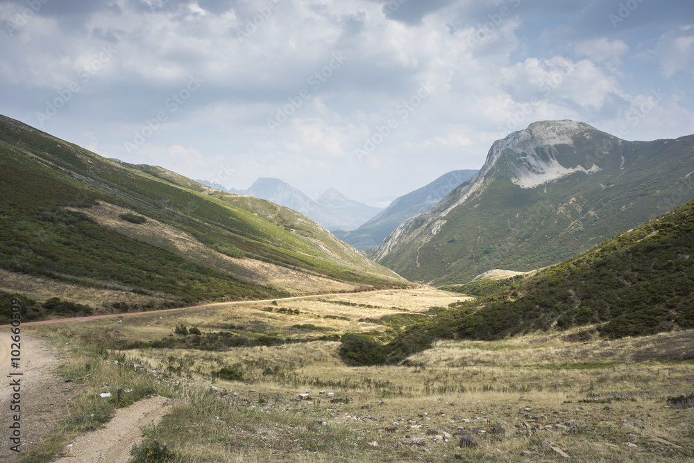 Views of Region of Babia, Province of Leon, from The Farrapona Mountain Pass, in Saliencia Valley, Somiedo Nature Reserve. It is located in the central area of the Cantabrian Mountains, Spain Views of Region of Babia, Province of Leon, from The Farrapona Mountain Pass, in Saliencia Valley, Somiedo Nature Reserve. It is located in the central area of the Cantabrian Mountains, Spain