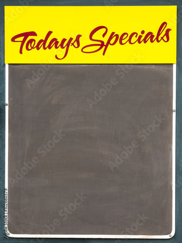 Well used black chalkbaord advertising Todays Specials