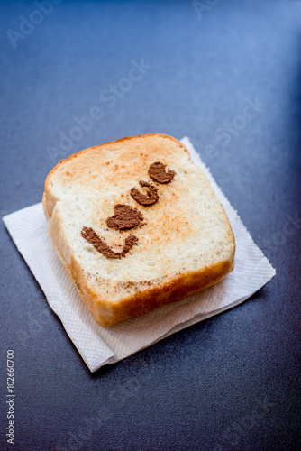 Love message on Bread sliced on leather background.