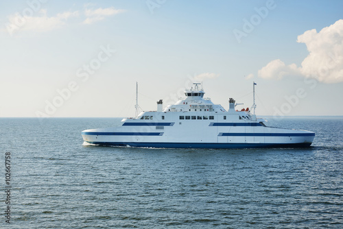 Doubleside ferry sailing in the bright sunny day photo