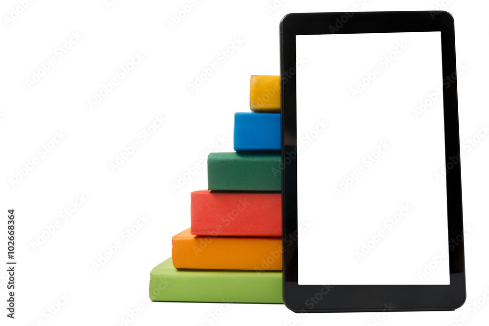 Stack of colorful books and electronic book reader. Electronic library concept. Back to school. Copy space Stack of colorful books and electronic book reader. Electronic library concept. Back to school. Copy space
