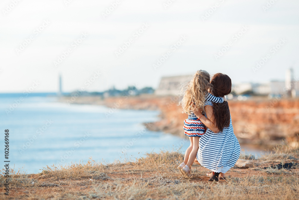 Mother and his adorable little daughter at beach Mother and his adorable little daughter at beach