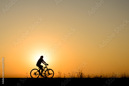 Wallpaper Mural Silhouette of cyclist motion on sunset background Torontodigital.ca