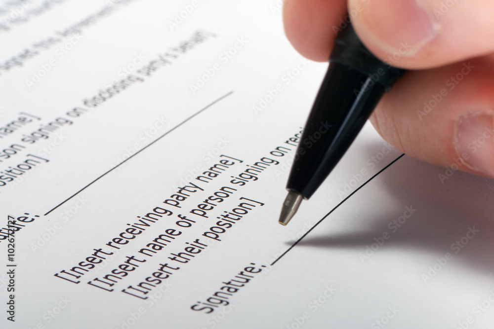 Businessman's hand signing papers. Lawyer, realtor, businessman Businessman's hand signing papers. Lawyer, realtor, businessman