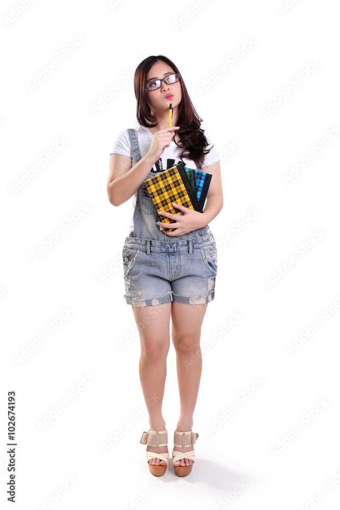 Imaginative school girl look up, full body isolated Imaginative school girl look up, full body isolated