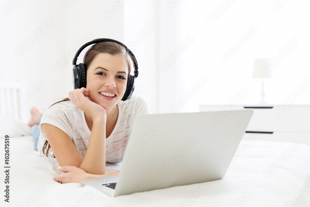 young woman watching a movie on laptop young woman watching a movie on laptop