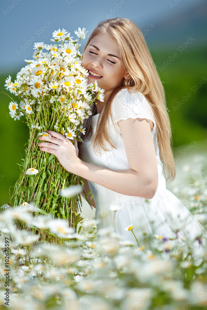woman with bunch and bouquet in a camomile field woman with bunch and bouquet in a camomile field