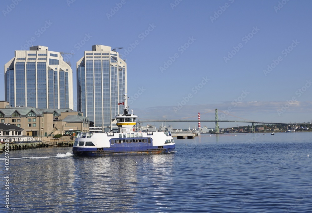 Halifax passenger ferry to Dartmouth crossing the Halifax Harbour, Purdy's and McDonald bridge towers in the background
Nova Scotia, Canada 